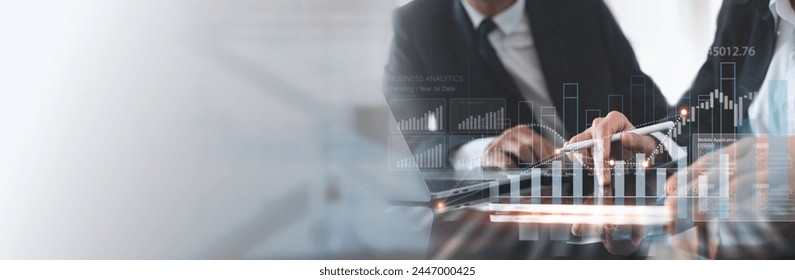 Business team using tablet and laptop analyzing sales data, economic growth graph chart. Business planning and strategy. Financial report, market research. digital marketing, business data analysis - Powered by Shutterstock