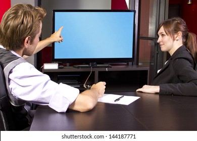 Business Team Watching A Blank Tv Screen