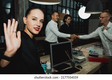 Business Team At Work. Portrait Of Two Cheerful Business People In Smart Casual Wear Discussing In Restaurant With Laptop And Diagrams Chart On Bar. Investment Property And Meeting Concept