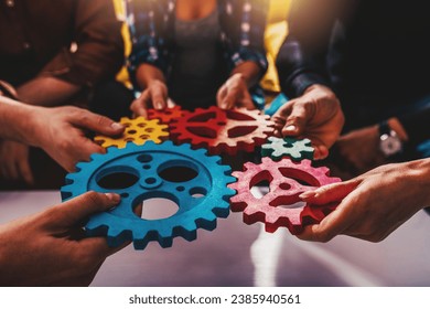 Business team work together and combine pieces of gears. Partnership and integration concept