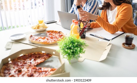 Business team workers discussing work and prepare pizza and potato chips to sharing meal at lunch break for good relations in office