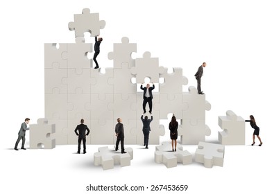 Business Team Working To Build A Puzzle