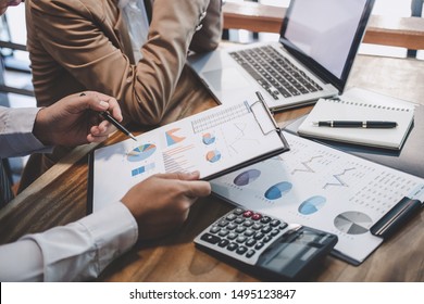 Business team working with new startup project plan and discussion information for financial strategy with laptop and digital tablet in a modern business lounge. - Shutterstock ID 1495123847