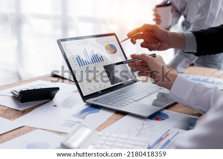 Business Team working at office with documents on his desk, doing planning analyzing the financial report, business plan investment, finance analysis concept	
