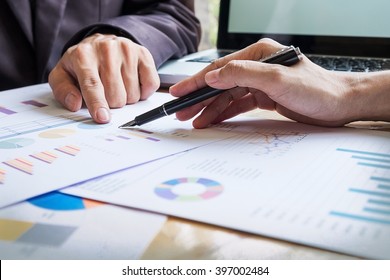 Business team working on a new business plan with modern digital computer - Shutterstock ID 397002484