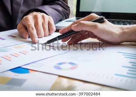 Business team working on a new business plan with modern digital computer