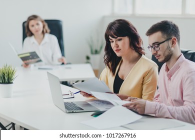 Business team working on a project in office - Shutterstock ID 1017267916