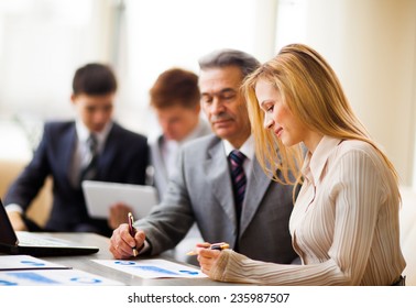 Business team working on their business project together at office