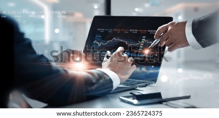 Business team working together. Businessman using laptop for analyzing data stock market graph with team pointing on the data presented in the chart, Stock trading, Strategy, Financial investment. 