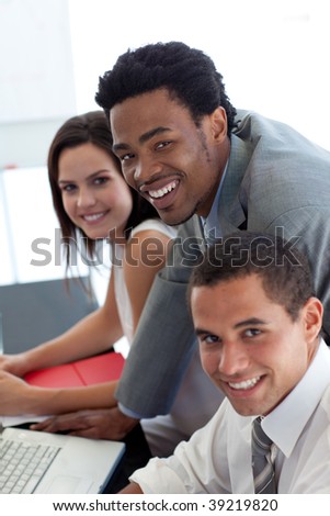 Business team working together with a laptop in office