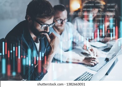 Business team working together at night office.Technical price graph and indicator, red and green candlestick chart and stock trading computer screen background. Double exposure. - Powered by Shutterstock