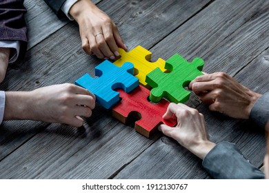 Business Teamwork With Color Puzzle Of Four Pieces Cooperation Unity Concept