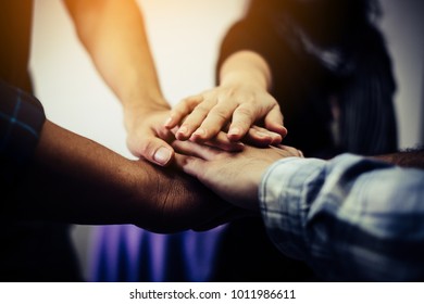 Business teamwork join hands together. Business teamwork concept - Shutterstock ID 1011986611