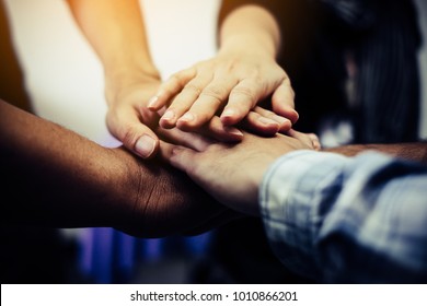 Business teamwork. Business man coworkers with joined hands together represent unity. Dedication and teamwork lead to success
 - Shutterstock ID 1010866201