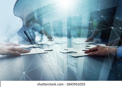 Business teamwork at the office. Workers join puzzle pieces on the desk. Partnership concept - Shutterstock ID 1845961033