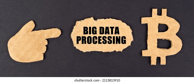 Business and technology concept. On a black background, cardboard figures of the bitcoin symbol and a hand pointing to a sign with the inscription - Big data processing