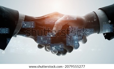 Business and technology concept. Shaking hands. GUI (Graphical User Interface).