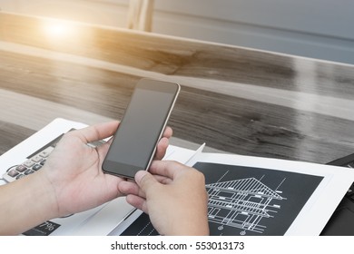 business technology concept,Business people hands use smart phone and laptop for business analyst project on table.,selective focus. - Shutterstock ID 553013173
