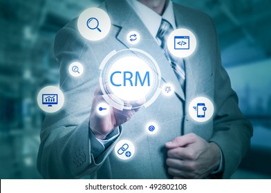 Business, Technology, Internet And Customer Relationship Management Concept. Businessman Pressing Crm Button On Virtual Screens