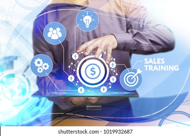 Business, Technology, Internet And Network Concept. Young Businessman Working On A Virtual Screen Of The Future And Sees The Inscription: Sales Training