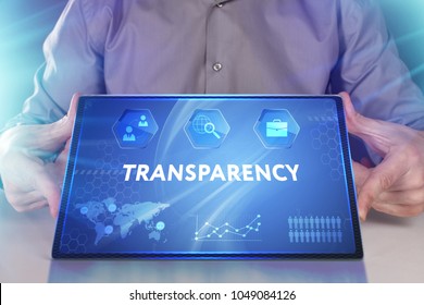 Business, Technology, Internet And Network Concept. Young Businessman Working On A Virtual Screen Of The Future And Sees The Inscription: Transparency