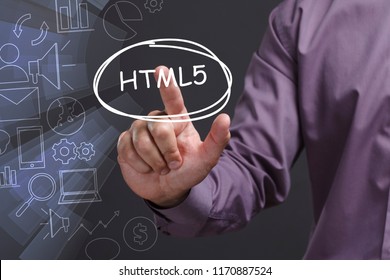 Business, Technology, Internet and network concept. Young businessman shows the word: HTML5