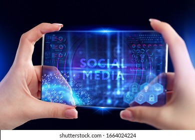 Business, Technology, Internet and network concept. Young businessman working on a virtual screen of the future and sees the inscription: Social media
