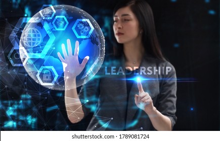 Business, Technology, Internet And Network Concept. Young Businessman Working On A Virtual Screen Of The Future And Sees The Inscription: Leadership