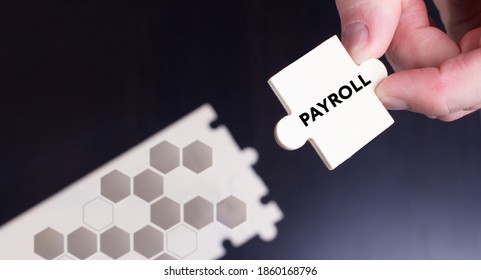 Business, Technology, Internet And Network Concept. Young Businessman Shows The Word: Payroll