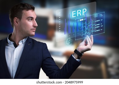 Business, Technology, Internet And Network Concept. Young Businessman Working On A Virtual Screen Of The Future And Sees The Inscription: ERP