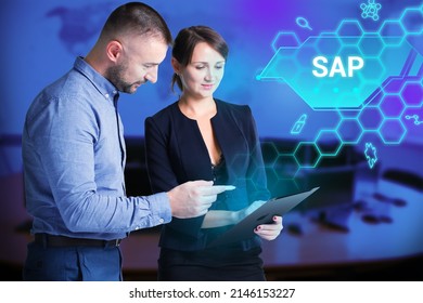 Business, Technology, Internet and network concept. Young businessman working on a virtual screen of the future and sees the inscription: SAP - Shutterstock ID 2146153227