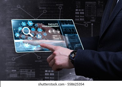Business, Technology, Internet and network concept. Young business man writing word: facility management  - Shutterstock ID 558625354