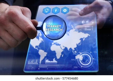 Business, Technology, Internet and network concept. Young businessman showing a word in a virtual tablet of the future: Market research