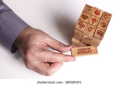 Business, Technology, Internet and network concept. Young businessman shows the word: Code of conduct - Shutterstock ID 589589291