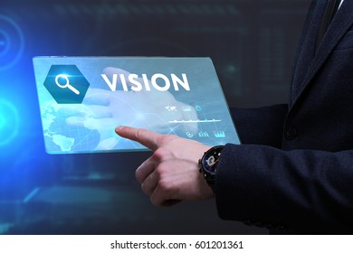Business, Technology, Internet and network concept. Young businessman working on a virtual screen of the future and sees the inscription: Vision - Shutterstock ID 601201361