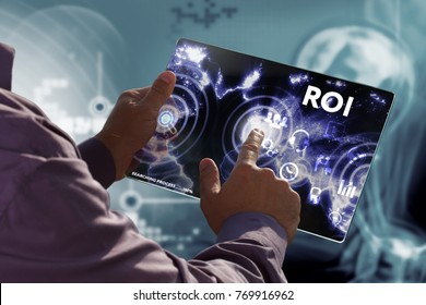 Business, Technology, Internet and network concept. Young businessman working on a virtual screen of the future and sees the inscription: ROI