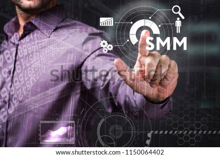 Business, Technology, Internet and network concept. Young businessman working on a virtual screen of the future and sees the inscription: SMM