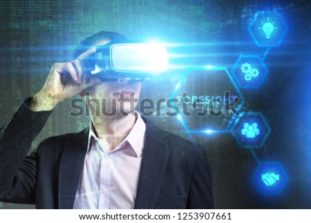 Business, Technology, Internet and network concept. Young businessman working in virtual reality glasses sees the inscription: Foresight