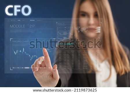 Business, Technology, Internet and network concept. Young businessman working on a virtual screen of the future and sees the inscription: CFO