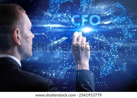 Business, Technology, Internet and network concept. Young businessman working on a virtual screen of the future and sees the inscription: CFO
