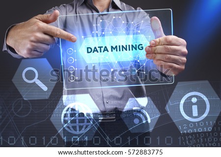 Business, Technology, Internet and network concept. Young businessman showing a word in a virtual tablet of the future: Data mining