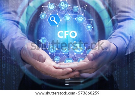 Business, Technology, Internet and network concept. Young businessman shows the word on the virtual display of the future: CFO