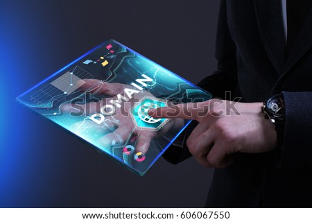 Business, Technology, Internet and network concept. Young businessman working on a virtual screen of the future and sees the inscription: Domain