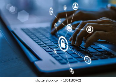 Business, Technology, Internet And Networking Concept. Young Businesswoman Working On His Laptop In The Office, Select The Icon Security On The Virtual Display.Blue Tone Concept