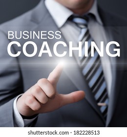 Business, Technology, Internet And Networking Concept - Businessman Pressing Business Coaching Button On Virtual Screens