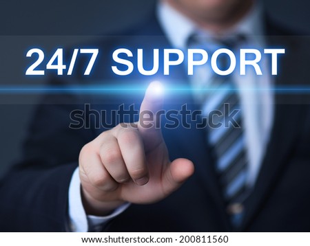 business, technology, internet and networking concept - businessman pressing 24/7 support button on virtual screens