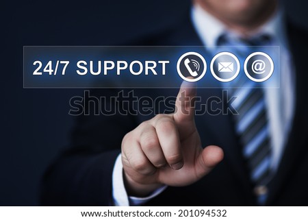 business, technology, internet and networking concept - businessman pressing 24/7 support button on virtual screens 