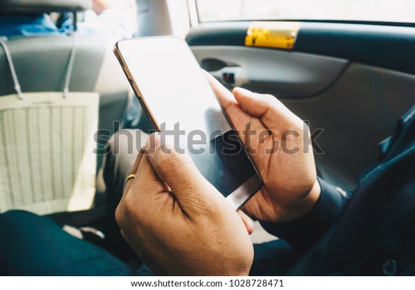 Business technology man hand use smartphone in car\
blank screen