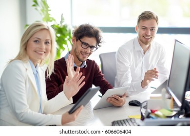 Business, Technology And People Concept - Creative Team With Tablet Pc Computers Waving Hands At Office