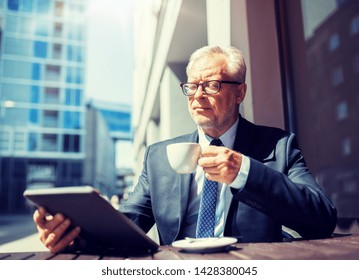 Business, Technology And People Concept - Senior Businessman With Tablet Pc Computer Drinking Coffee At City Street Cafe